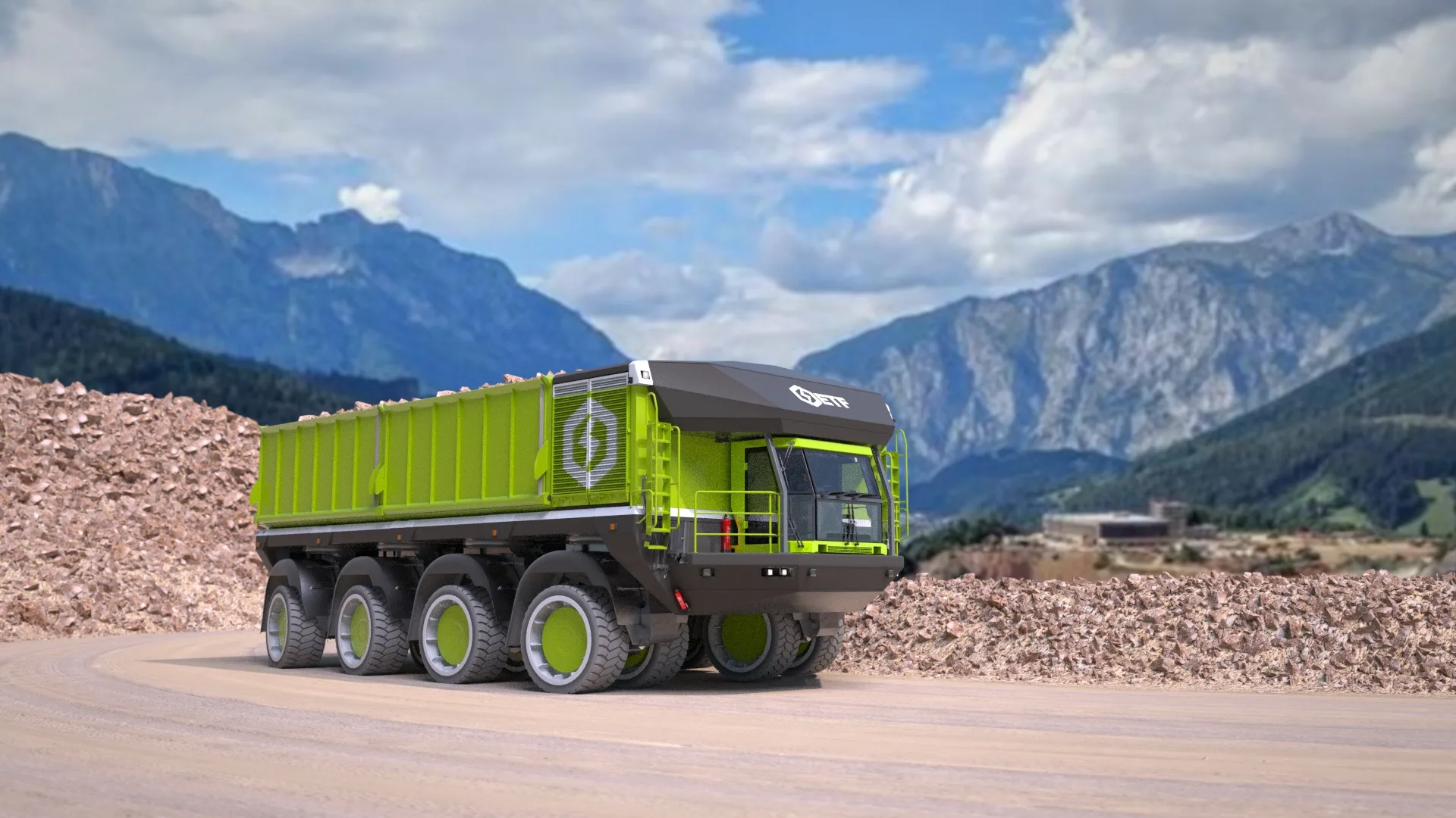 A loaded ETF D4 working a haul road in wet mountain terrain